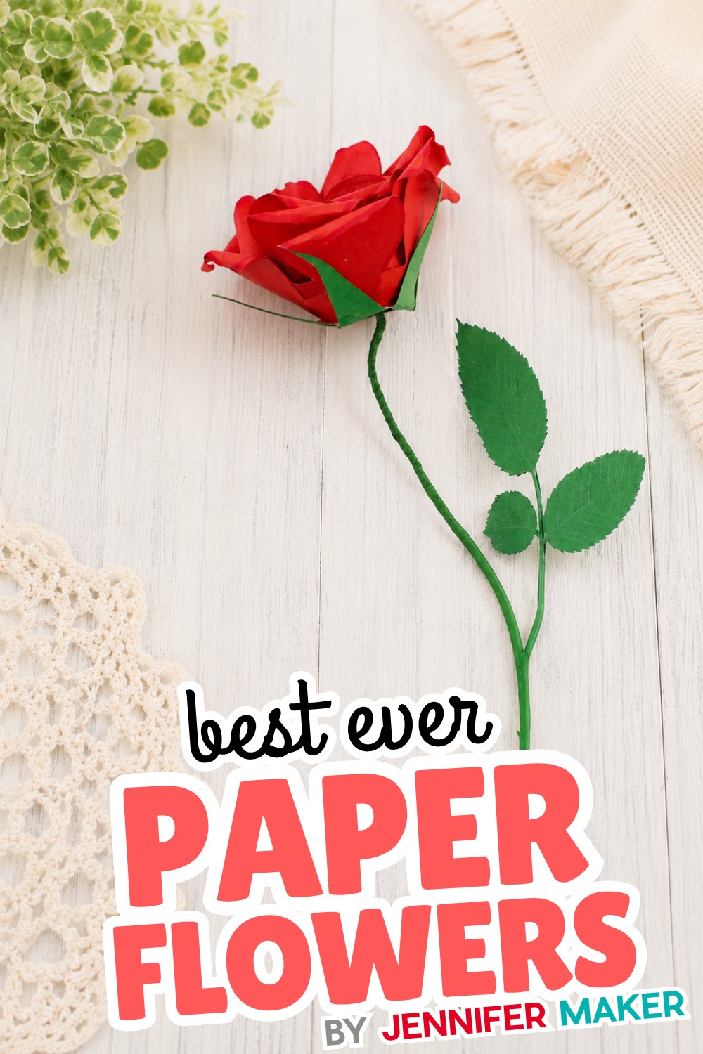 A realistic rolled paper rose made from red cardstock